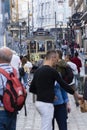 Tram and people walking in Santa Catarina street Porto