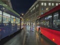 Tram rushes at night in front of the historic Zytglogge (clock tower) in Bern