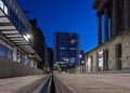 Tram stop at night in Birmingham city centre during blue hour with modern tower block skyscrapers. L Royalty Free Stock Photo