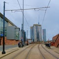 Tram tracks leading towards highrise modern officebuildings in Manchester