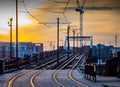 Tram and tramlines in central Manchester, UK, with setting sun a Royalty Free Stock Photo