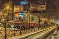 Tram in the winter night, snowfall Royalty Free Stock Photo