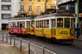 Tram 28, Yellow and Red Trolley Car Traveling Down the Street of Lisbon, Portugal