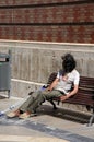 Tramp sitting on bench, Malaga.