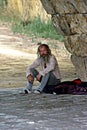 Tramp sitting under the bridge of Triana in Seville 3