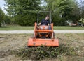 Tramping A Tree Limb Pile Down With A Front End Loader