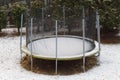 Trampoline with snow at winter time