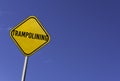 Trampolining - yellow sign with blue sky background