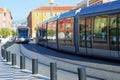 Trams in the center of Nice, France. Reflection of buildings in the windows of the tramway