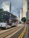 Trams running at Johnston Road in Wan Chai Hong Kong Royalty Free Stock Photo