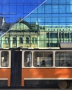 Tramway in front of glass office building in Cluj Napoca, Romania