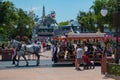 Tramway on horseback and partial view of Tomorrowland in Magic Kingdom at Walt Disney World area.