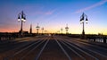 Tramway rails tracks in sunset light at Pont de pierre crossing Garonne river, Bordeaux,France Royalty Free Stock Photo