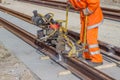 Tramway track construction worker with rail grinding machine 2 Royalty Free Stock Photo