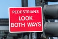 Pedestrians look both ways red board