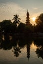 Tran Quoc Pagoda reflecting in lake, Hanoi, Vietnam at sunset