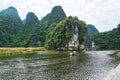 Trang An, Ninh Binh, Vietnam. June 9, 2019: People taking Boat tour to king kong skull island. Trang An is UNESCO World