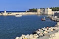 Trani, Italy - Panoramic view of the Molo, historic defense walls and sea shore breakwaters at the Adriatic sea shore in Trani old