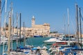 View of a nice fishing harbor and marina in Trani, with San Nicola Pellegrino Cathedral of Trani, Puglia region, Italy Royalty Free Stock Photo