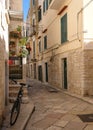 Street scene with bicycle in the foreground, in the Jewish Quarter of the historic medieval town of Trani in Puglia, Italy