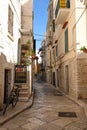 Street scene with bicycle in the foreground, in the Jewish Quarter of the historic medieval town of Trani in Puglia, Italy