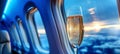 Tranquil aerial view serene blues from plane window with elegant champagne glass on desk