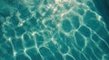 Sunlight Reflecting and Refracting on a Blue Swimming Pool Creating Light Patterns Royalty Free Stock Photo