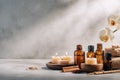 Serene aromatherapy arrangement with candles, oils, towels and orchid bloom Royalty Free Stock Photo
