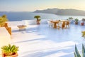 Tranquil Atmosphere at Open Air Terrace Restaurant in Beautiful Oia Village on Santorini Island in Greece in Front of Volcanic Royalty Free Stock Photo