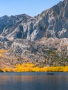 Tranquil autumn scene with a fishing boat on the lake Royalty Free Stock Photo