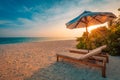 Beautiful sunset beach. Chairs on the sandy beach near the sea. Summer holiday and vacation concept. Inspirational tropical scene. Royalty Free Stock Photo