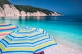 Tranquil beach scene. Picturesque landscape of mediterranean island with colorful umbrellas. Summer vacation holiday concept Royalty Free Stock Photo