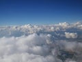 Tranquil Beautiful View From Plane Window at Blue Sky over White Clouds