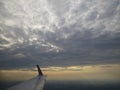 Tranquil Beautiful View From Plane Window at Blue Sky over White Clouds with a Wing Royalty Free Stock Photo