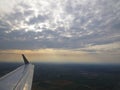 Tranquil Beautiful View From Plane Window at Blue Sky over White Clouds with a Wing Royalty Free Stock Photo