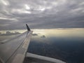 Tranquil Beautiful View From Plane Window at Blue Sky over White Clouds with a Wing Royalty Free Stock Photo