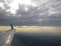 Tranquil Beautiful View From Plane Window at Blue Sky over White Clouds with a Wing Royalty Free Stock Photo