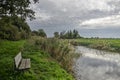 Tranquil bench along a creek