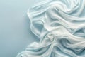 Tranquil blue silk waves flowing fabric abstract background with ample space for text