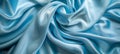 Tranquil blue silk waves soft flowing fabric abstract background with copy space