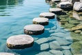 Tranquil blue water oasis for zen meditation with stepping stones for relaxation and mindfulness Royalty Free Stock Photo