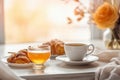 Tranquil Breakfast with Croissants and Tea