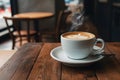 Tranquil cafe scene single hot coffee cup beckons customers Royalty Free Stock Photo