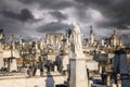 an image of a very cemetery in the daytime with storm clouds