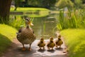 Tranquil Duck Family Strolls Pondside. Royalty Free Stock Photo