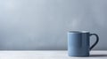 Tranquil Elegance: Blue Mug Set Against a Serene Gray Background