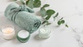 Tranquil eucalyptus spa essentials arranged on pristine marble surface with glowing candle ambiance Royalty Free Stock Photo