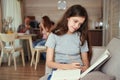 Tranquil focused adolescent girl learning at home Royalty Free Stock Photo