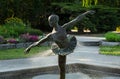 Tranquil fountain featuring a small statue of a graceful ballerina in the Botanical Garden of Poznan
