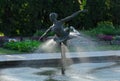 Tranquil fountain featuring a small statue of a graceful ballerina in the Botanical Garden of Poznan